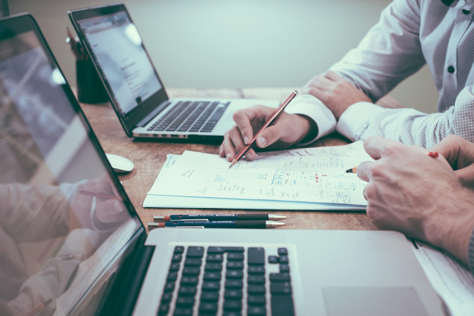 Two people reviewing plans at a desk